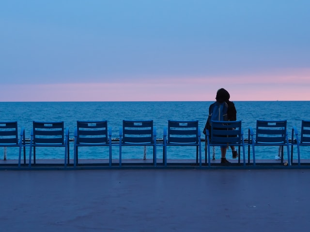 Introvert girl sitting alone on a chair